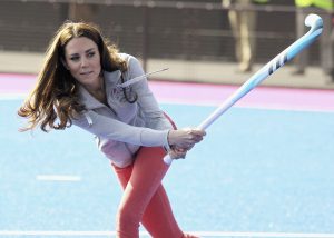 Britain's Duchess of Cambridge hits a shot as she plays hockey with the British Olympic hockey teams at the Riverside Arena in the Olympic Park, London, Thursday March 15, 2012. The Duchess of Cambridge viewed the Olympic Park and met members of the men's and women's British hockey teams. (AP Photo/Chris Jackson, Pool)